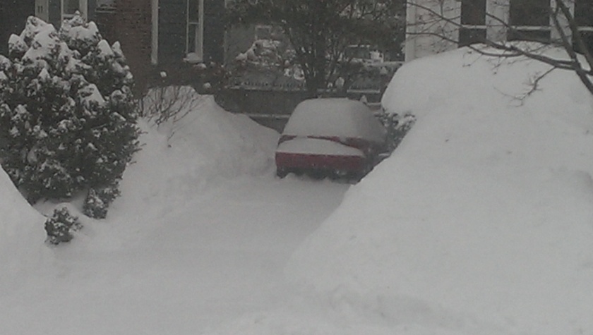 car in snowy driveway